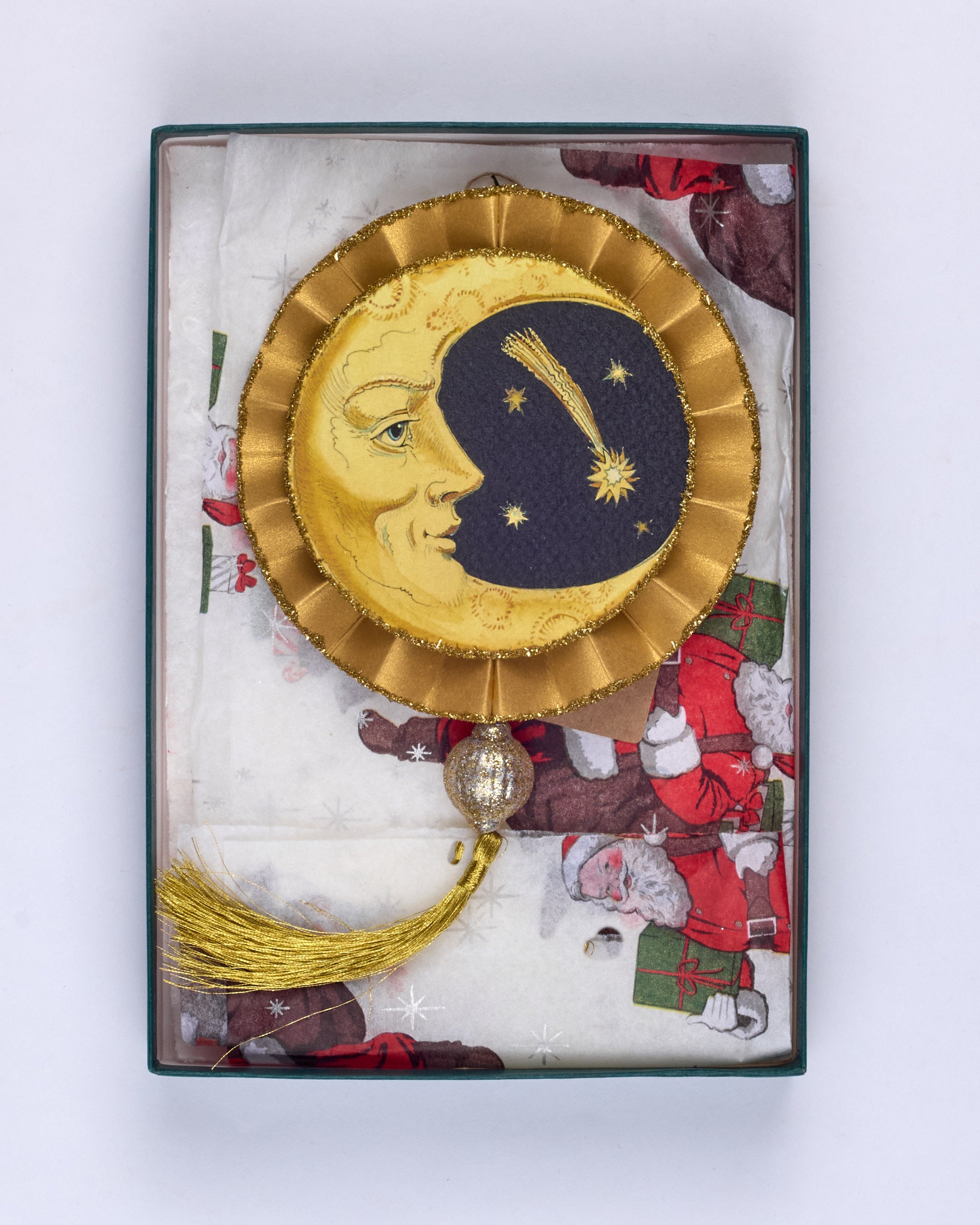 An original, handmade Christmas decoration showing crescent and full moons
