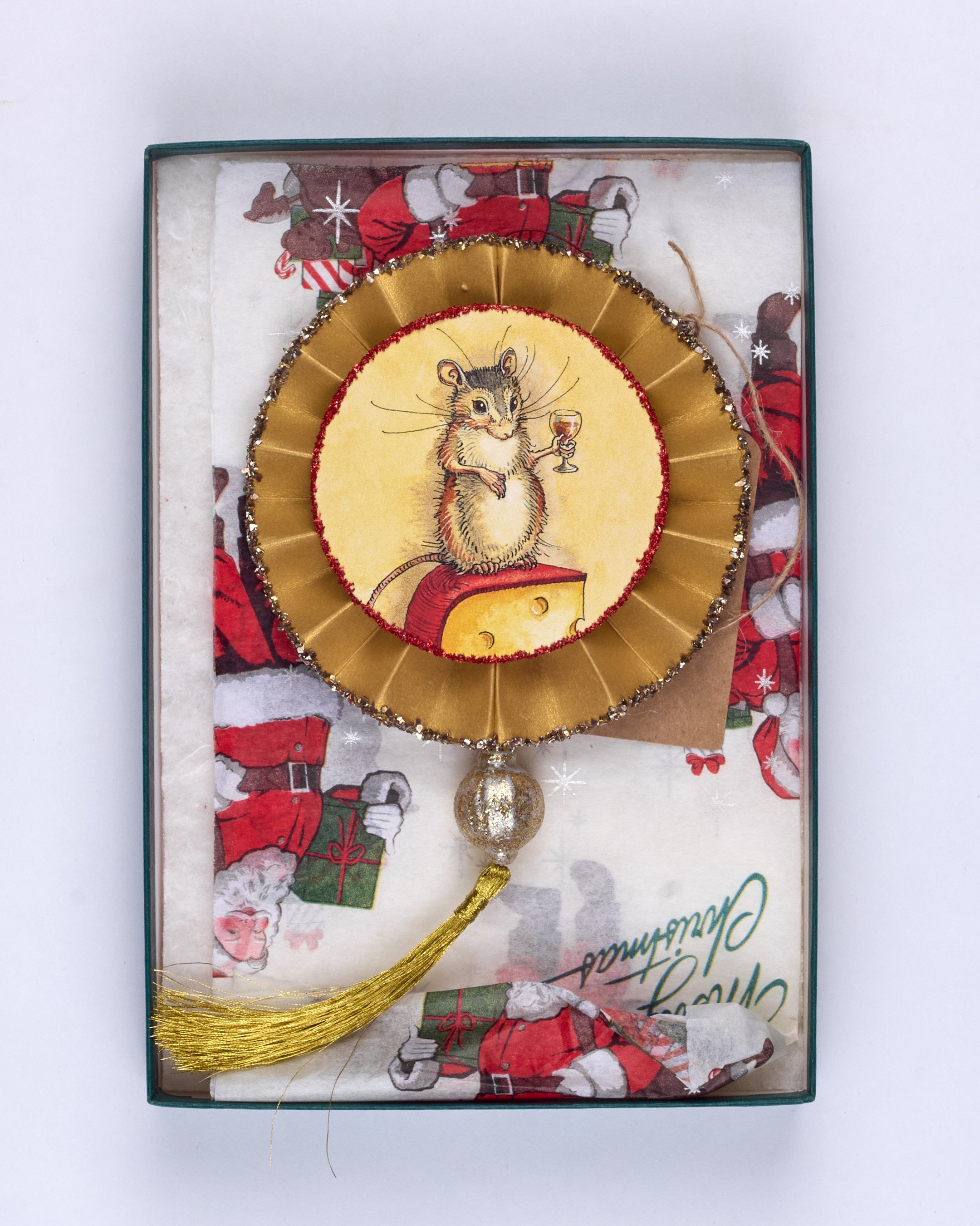 An original, handmade Christmas decoration showing a mouse holding a glass of red wine and another with Christmas antlers